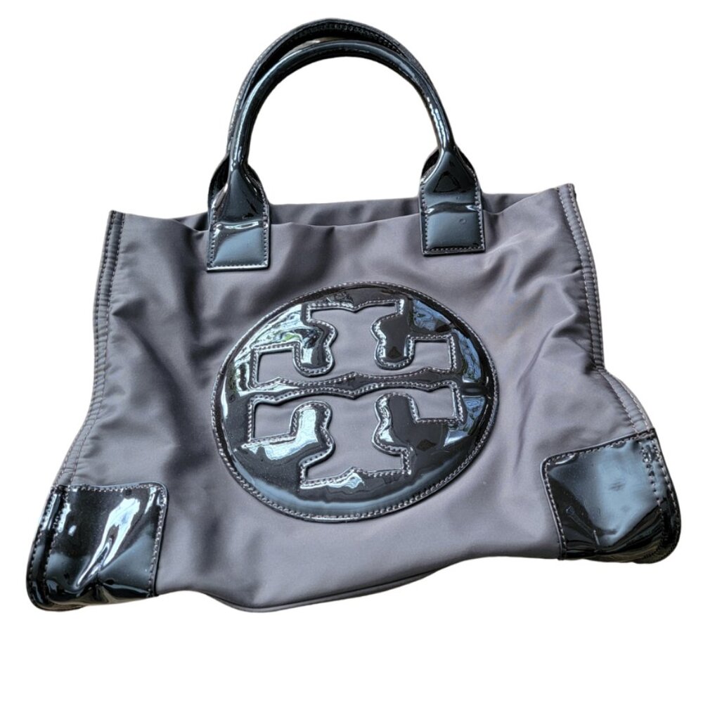 Tory Burch Ella nylon tote bag with patent leather trim and a large logo patch.